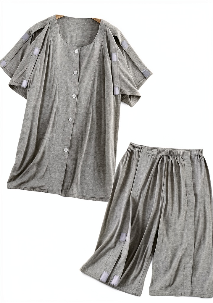 Patient Suit LAROTSUBA nursing gown gray medium displayed on a hospital linen cart
